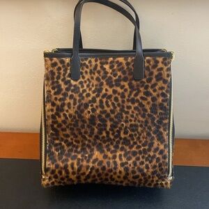 Henri Bendel animal print reverses to leather. shopping bag tote Removable strap